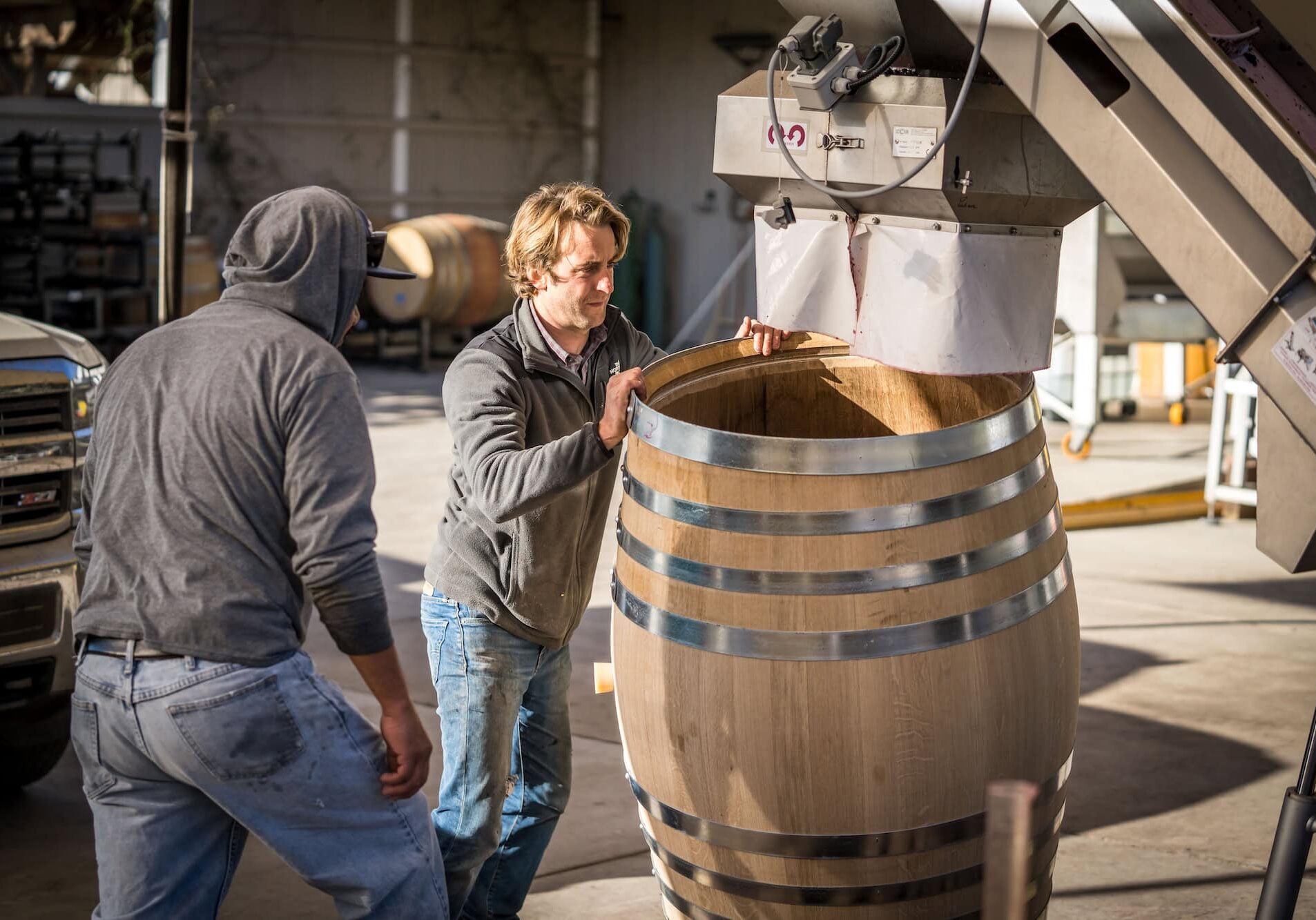Filling a barrel with wine