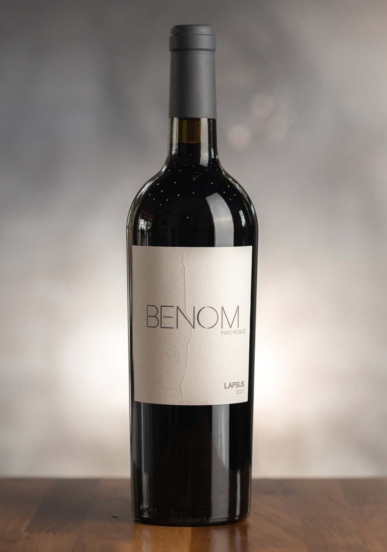 A bottle of 2021 Lapsus BENOM wine